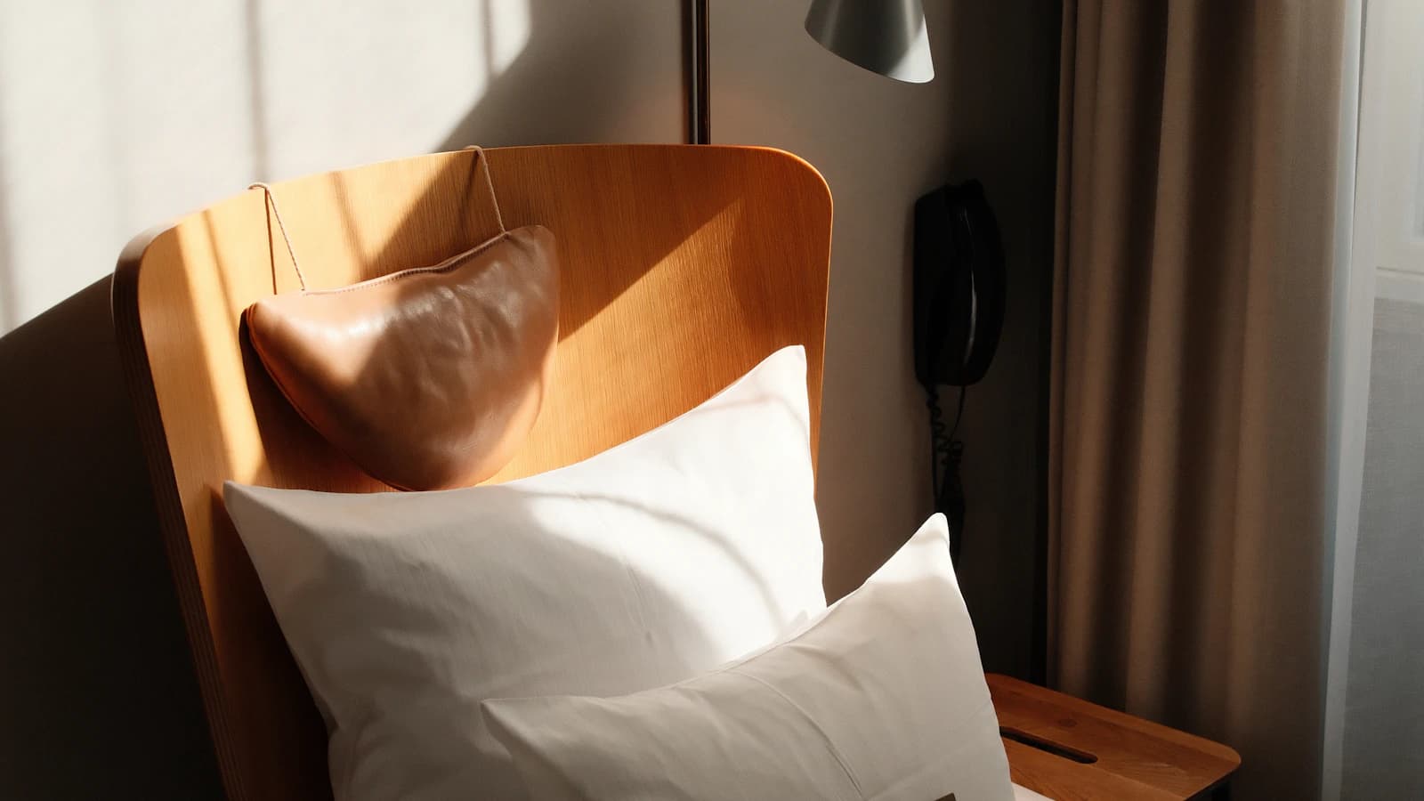 A neatly prepared hotel room representing the hotel portion of a mixed host-and-hotel stay