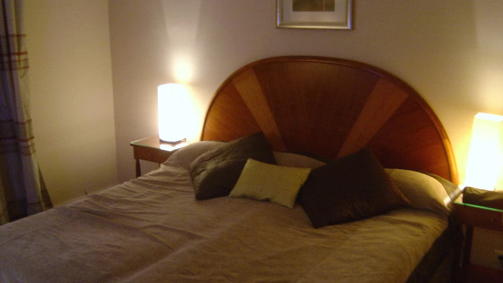 A hotel room with a double bed