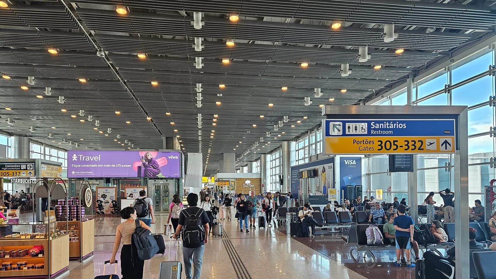 A bright international airport departure lounge before an onward journey